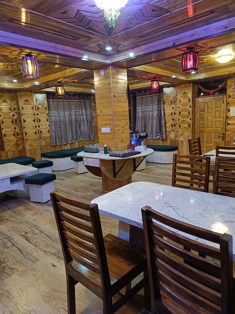 Wood-panelled dining room at Negi Cottage
